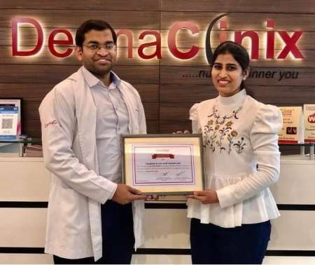 Dr. Sneha Kovi, the best Trichologist in Guntur receiving her training certification for hair transplantation