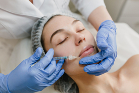 A woman undergoing dermal fillers procedure