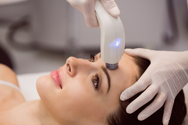 A woman undergoing Laser Toning Treatment