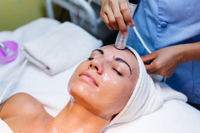 A woman undergoing medifacial treatment